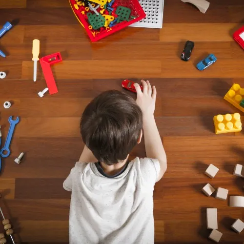 Boy playing with toys | The Carpet Gallery